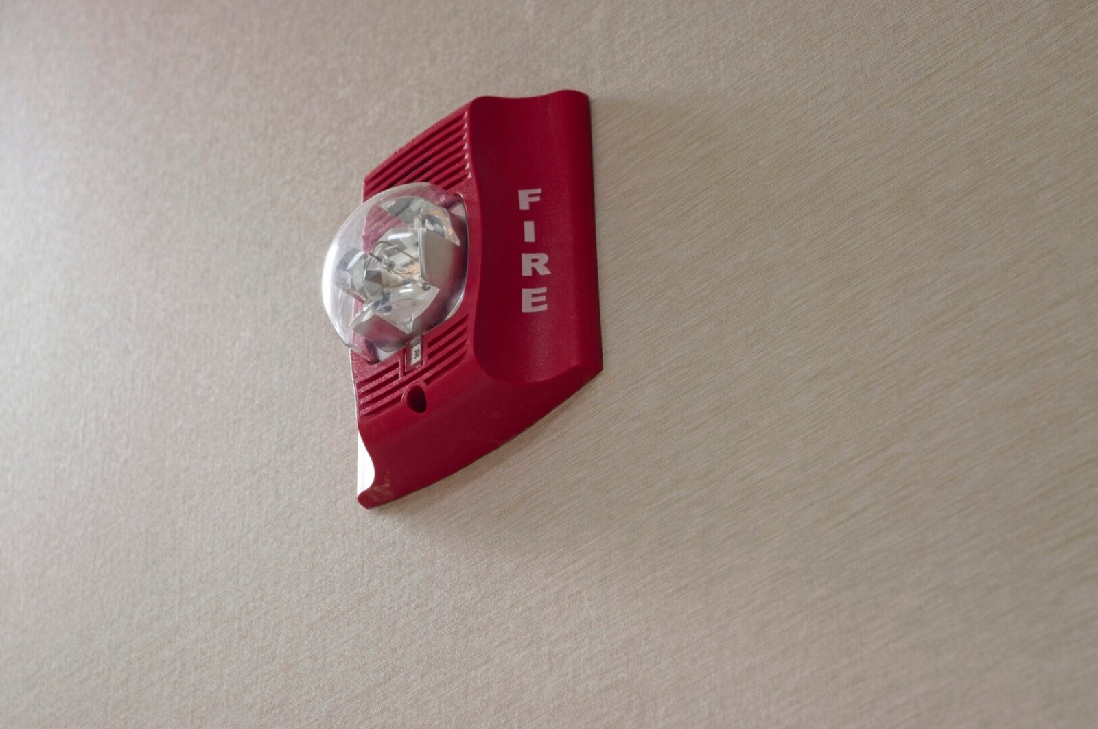 Emergency fire alarm with light fixture