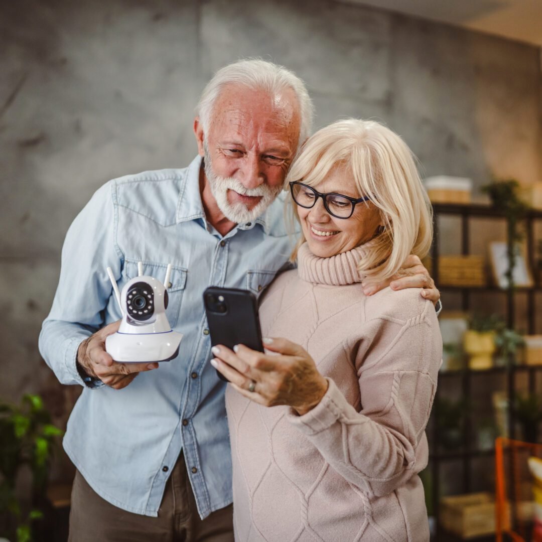 Happy couple with a camera