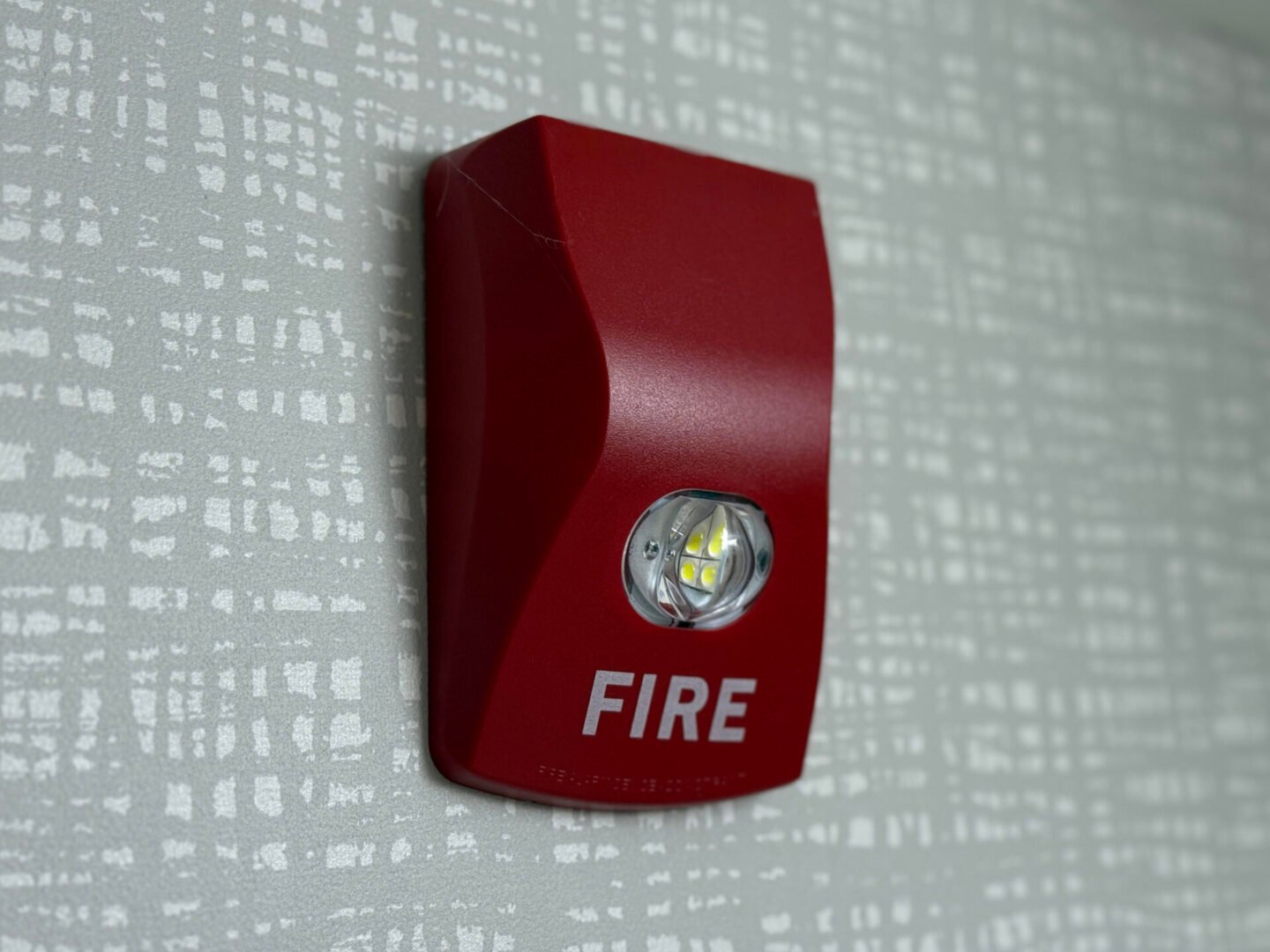Emergency fire alarm with light